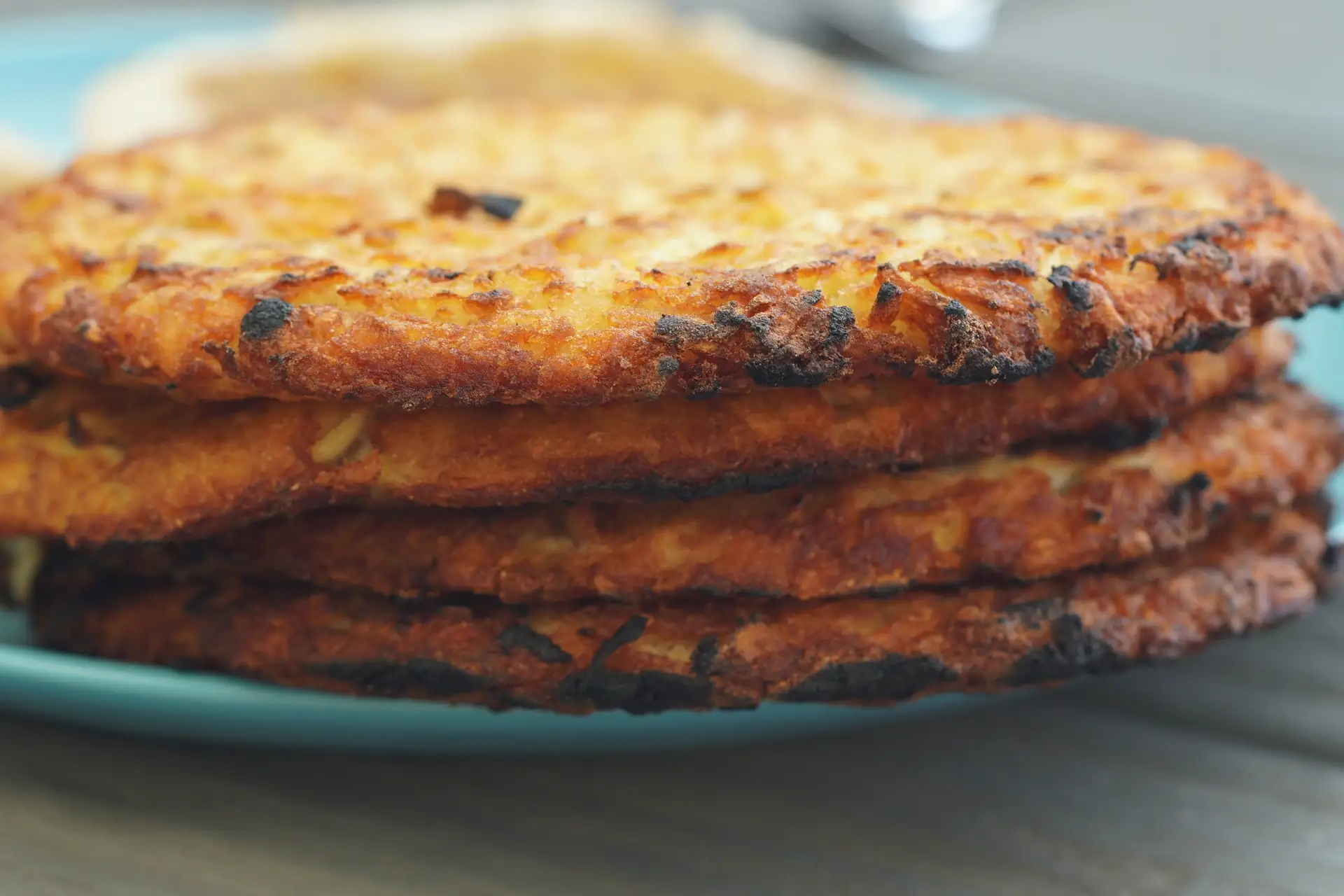 Hashbrowns stacked on top of each other like a pancake.